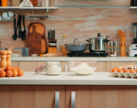 pastry-ingredients-homemade-cakes-bread-empty-kitchen-modern-dining-room-equipped-with-utensils-ready-cooking-with-wheat-flour-glass-bowl-fresh-eggs-table (1)